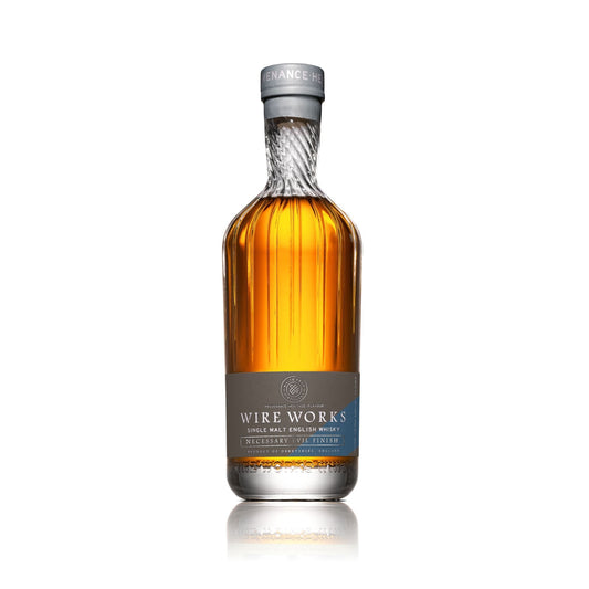 Single malt whisky bottle with silver foil neck and amber liquid, Wire Works label