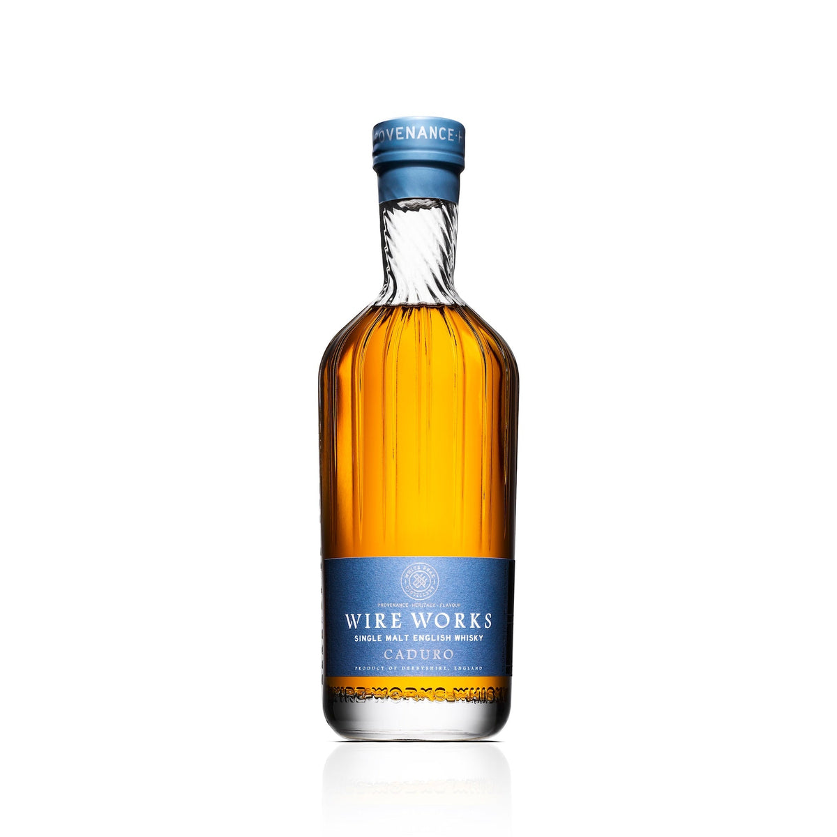 Single malt whisky bottle with blue foil neck and amber glass, Caduro label